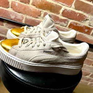 Gold and suede puma sneakers